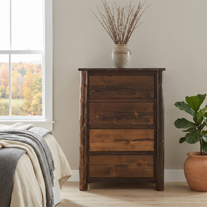 Mount Audubon Cedar Log Chest of Drawers beside a bed with a vase of branches and a potted plant near a sunny window
