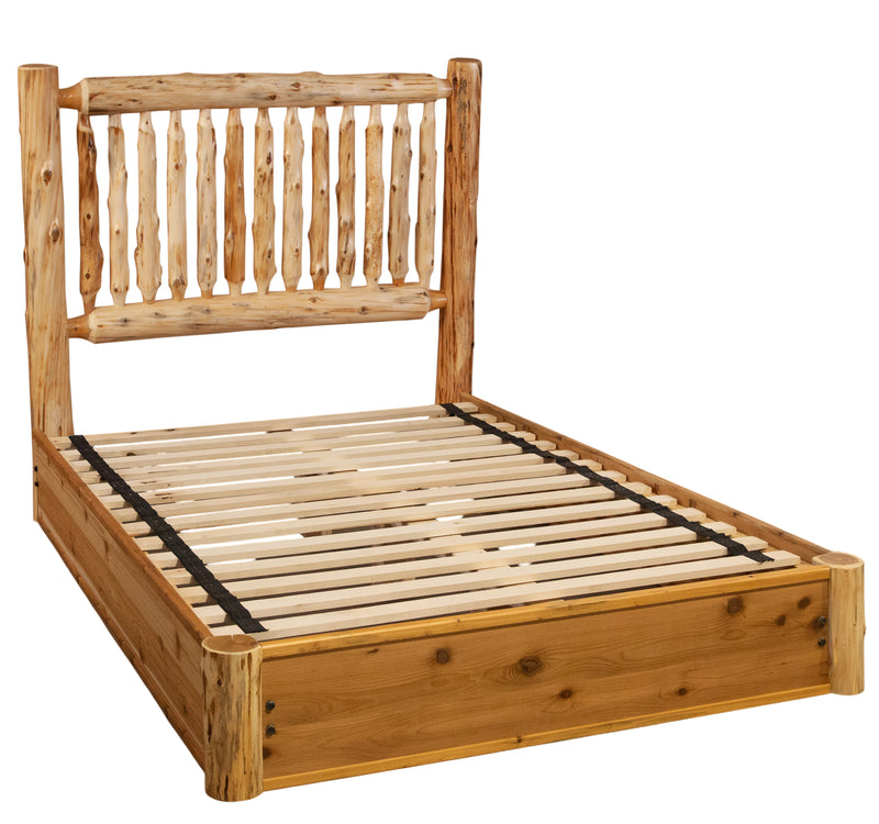 Angled view of the Mount Bierstadt Cedar Log Spindle Platform Bed showing the cedar spindle headboard and slatted platform without mattress