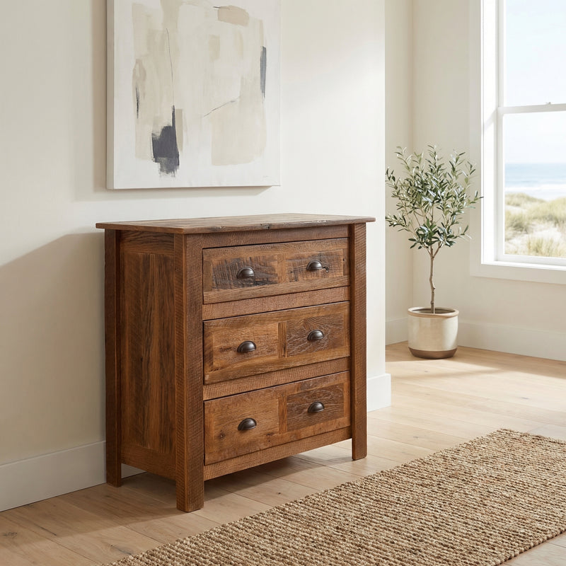 Mount Buckskin Reclaimed Barnwood Chest of Drawers with a potted olive tree beside it in a bright, airy room with framed art