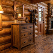 Mount Buckskin Reclaimed Barnwood Chest of Drawers below a mirror and coat hooks in a log cabin entryway