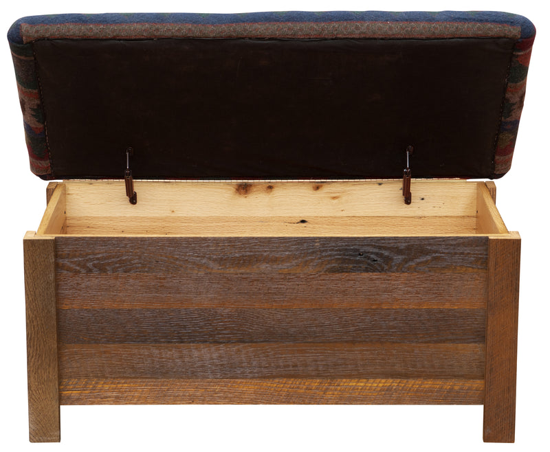 Close-up of the Mount Chiquita Reclaimed Barnwood Blanket Chest upholstered fabric top and barnwood corner
