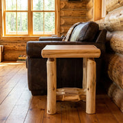 Mount Emma Cedar Log Open End Table staged in a sunlit log cabin living room