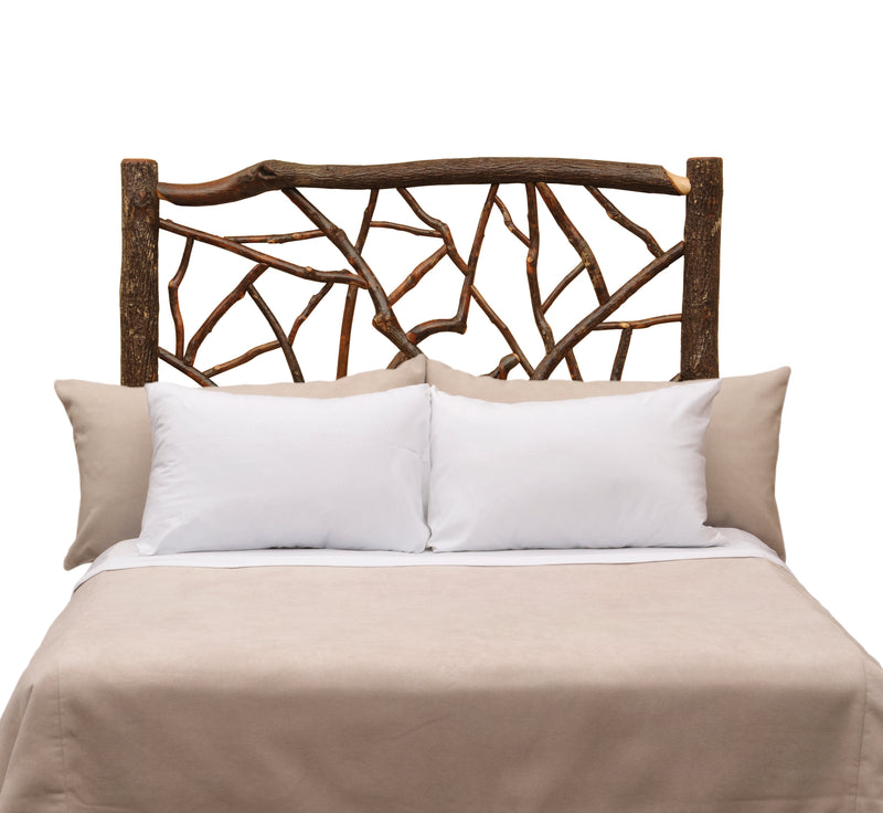 Front view of the Mount Eolus Hickory Log Twig Headboard styled with white pillows and taupe bedding