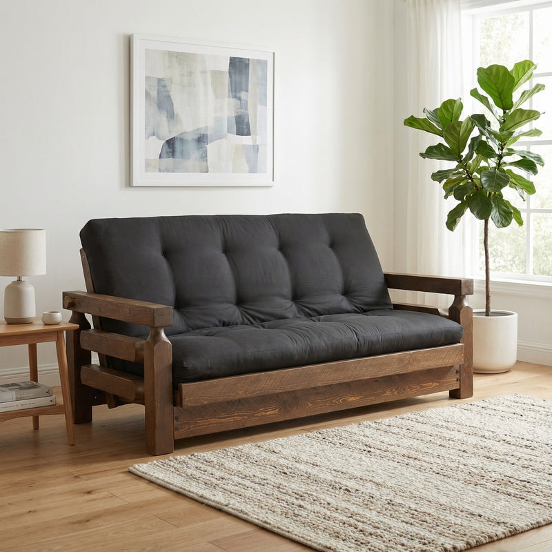 Mount Epaulet Pine Futon with a dark cushion in a bright cabin living room