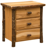 Angled view of the Mount Flora Hickory Log Three Drawer Nightstand in Natural showing three drawers and bark-on posts