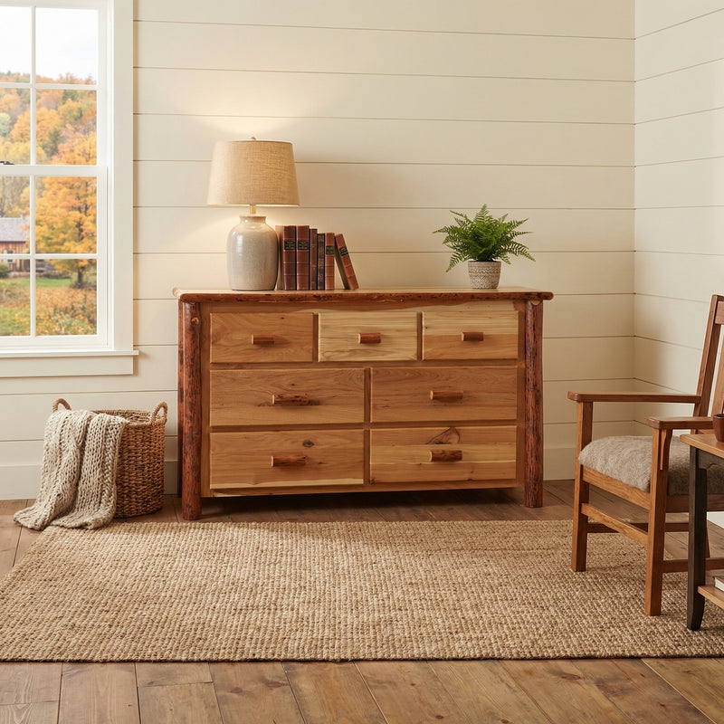 Mount Garfield Hickory Log Dresser in Natural with a lamp and plant on top in a bright bedroom beside a wood chair