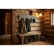 Mount George Pine Wall Coat Rack staged on a log wall in a rustic cabin mudroom entryway