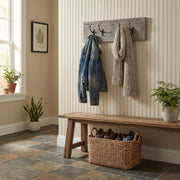 Mount George Pine Wall Coat Rack with jackets in a cabin entryway