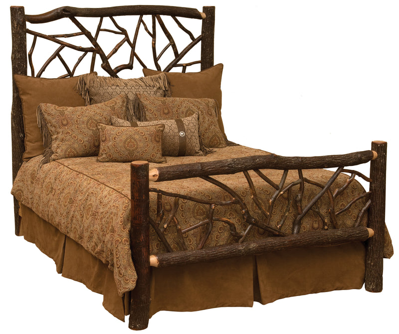 Angled view of the Mount Harvard Hickory Log Twig Bed with brown bedding showing the bark-on hickory twig headboard and footboard