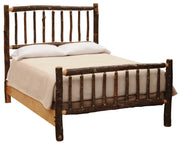 Angled view of the Mount Lincoln Hickory Log Bed with cream bedding showing bark-on hickory spindles and natural side rails