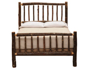 Front view of the Mount Lincoln Hickory Log Bed showing the hickory spindle footboard with cream bedding