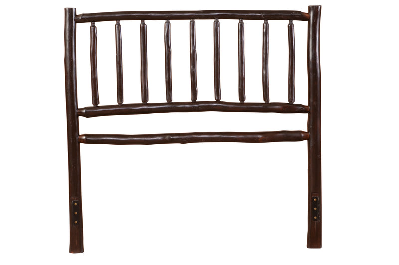 Detail of the Mount Lincoln Hickory Log Bed headboard with bark-on hickory posts and spindles
