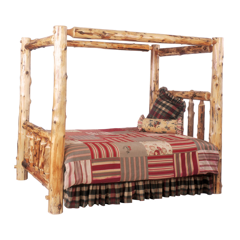 Angled view of the Mount Massive Cedar Log Canopy Bed showing four log canopy posts and spindle headboard with patchwork bedding