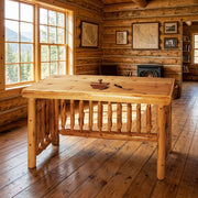 Mount Mestas Cedar Log Writing Desk staged in a sunlit log cabin home office