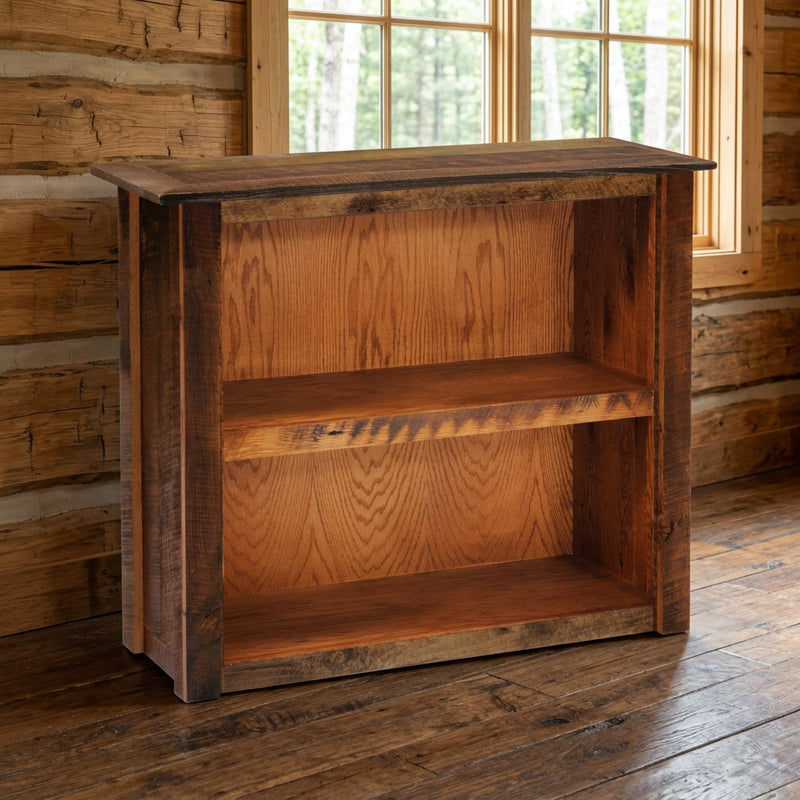 Mount Neota Reclaimed Barnwood Two Shelf Bookcase staged in a sunlit log cabin home office