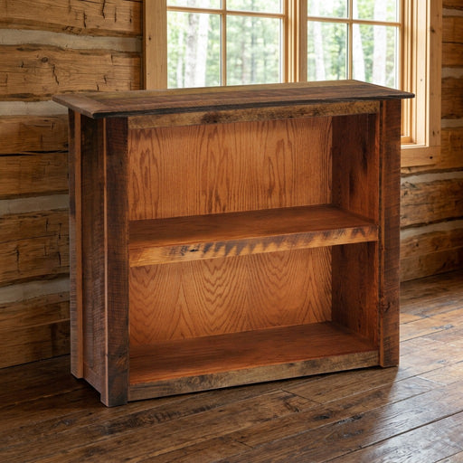 Mount Neota Reclaimed Barnwood Two Shelf Bookcase staged in a sunlit log cabin home office