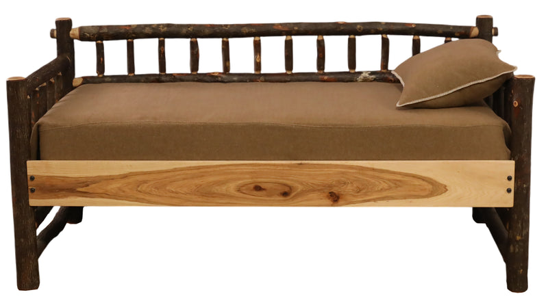 Front view of the Mount of the Holy Cross Hickory Daybed with a brown mattress and pillow