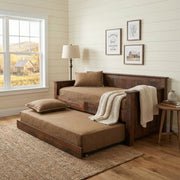 Mount Ouray Reclaimed Barnwood Daybed with roll-out trundle in a white shiplap guest room with framed art and a cream throw