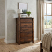 Mount Powell Cedar Log Chest of Drawers in a bright bedroom beside a window with a table lamp and potted plant on top