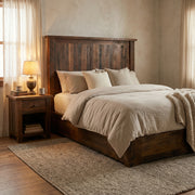 Mount Shavano Reclaimed Barnwood Platform Bed with cream bedding and a barnwood nightstand in a softly lit farmhouse bedroom