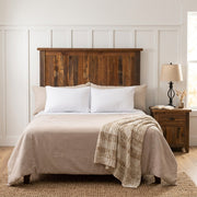 Mount Sherman Reclaimed Barnwood Headboard against white board and batten walls with a reclaimed wood nightstand and iron lamp