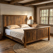 Mount Sneffels Reclaimed Barnwood Bed staged in a farmhouse cabin bedroom with shiplap walls, ceiling beams, and a jute rug