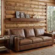 Mount Tileston Reclaimed Barnwood Floating Shelf staged in a sunlit log cabin living room