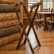 Mount White Hickory Log Tray Stand staged in a sunlit log cabin dining room