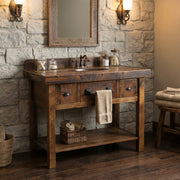 Mount Zion Reclaimed Barnwood Two Drawer Vanity with Artisan Top against a stone bathroom wall