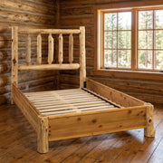 Music Mountain Cedar Log Traditional Bed with Rail System staged in a sunlit log cabin bedroom