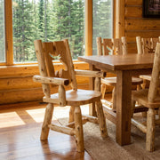 Parika Peak Cedar Log Cutout Dining Arm Chair with a moose cutout at a log dining table