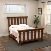 Pikes Peak Reclaimed Barnwood Post Bed with white bedding in a bright bedroom with a window and potted plant