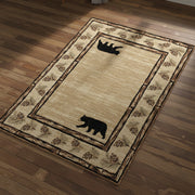Beige area rug with bear designs and pine cone border on a white background