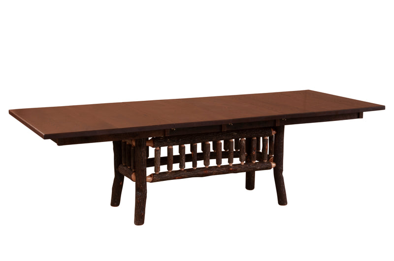 Angled view of the Powell Peak Oak and Hickory Log Extension Dining Table