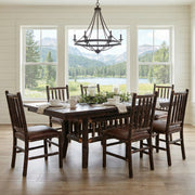 Powell Peak Oak and Hickory Log Extension Dining Table set with chairs in a bright dining room