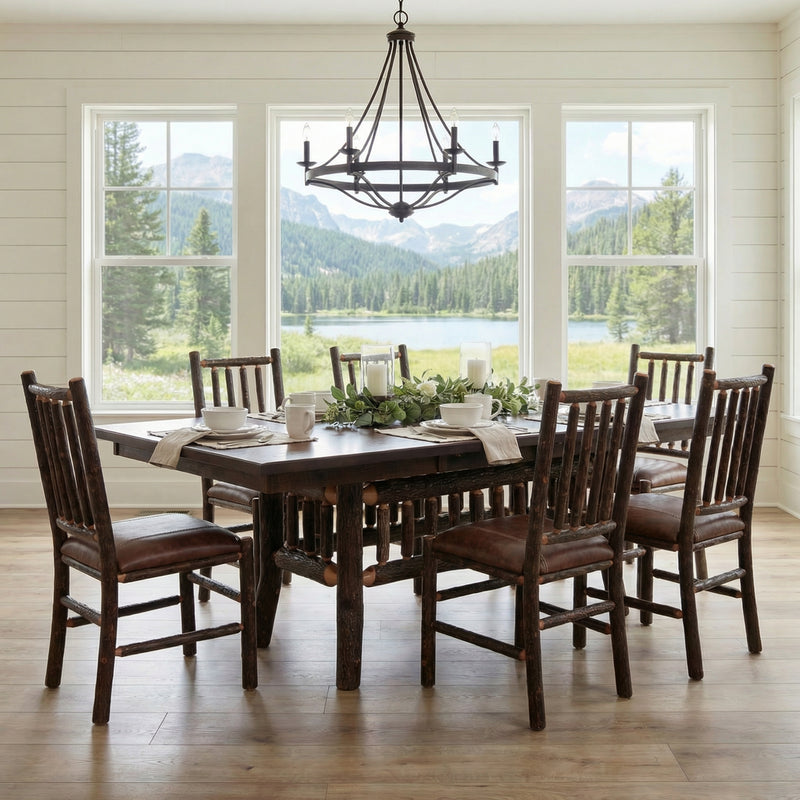 Powell Peak Oak and Hickory Log Extension Dining Table set with chairs in a bright dining room
