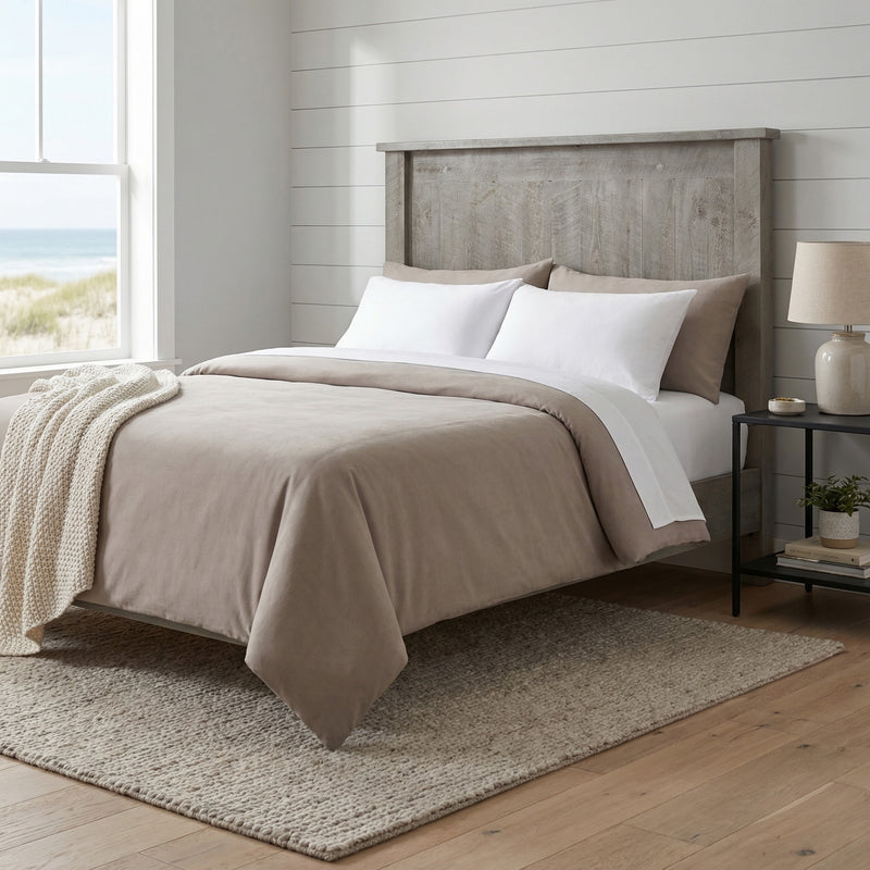 Ptarmigan Point Pine Plank Headboard behind a bed with gray bedding in a coastal cabin bedroom