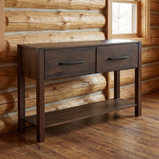 Quail Mountain Solid Hickory Two Drawer Console Table staged in a sunlit log cabin living room