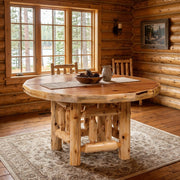 Red Mountain Cedar Log Round Dining Table staged in a sunlit log cabin dining room