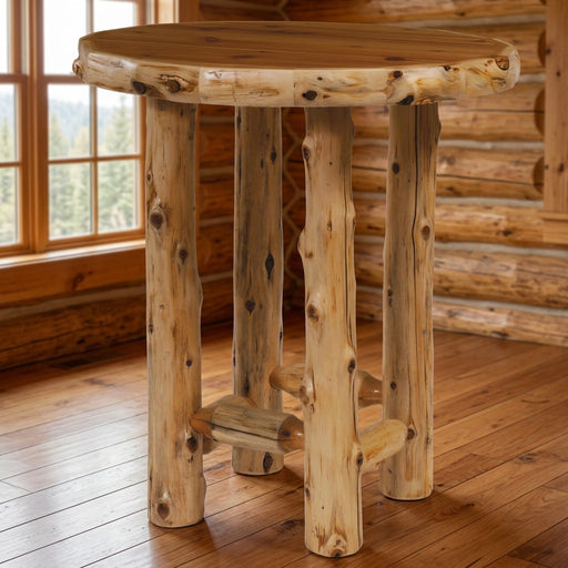 Rogers Pass Cedar Log Round Pub Table staged in a sunlit log cabin dining room
