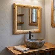 Rolling Mountain Cedar Log Mitered Corner Mirror in a cabin bathroom