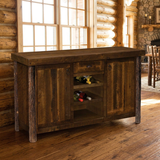 Rosedale Peak Barnwood and Hickory Wine Rack Sideboard staged in a sunlit log cabin dining room
