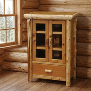 Ruby Peak Cedar Log Media Cabinet staged in a sunlit log cabin living room