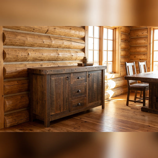Snowdon Peak Reclaimed Barnwood Sideboard staged in a sunlit log cabin dining room