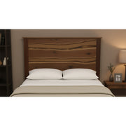 Star Peak Live Edge Walnut Headboard behind a bed with white bedding