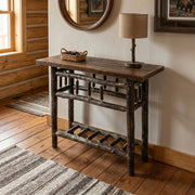 Stones Peak Barnwood and Hickory Open Sofa Table with a table lamp in a sunny entryway