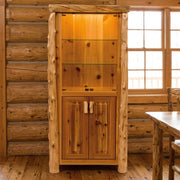 Tepee Mountain Cedar Log Lighted Display Cabinet staged in a sunlit log cabin dining room