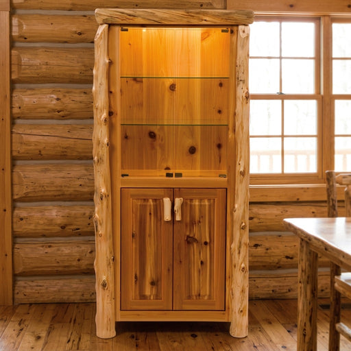 Tepee Mountain Cedar Log Lighted Display Cabinet staged in a sunlit log cabin dining room