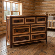 Treasury Mountain Reclaimed Barnwood Seven Drawer Dresser staged in a sunlit log cabin bedroom