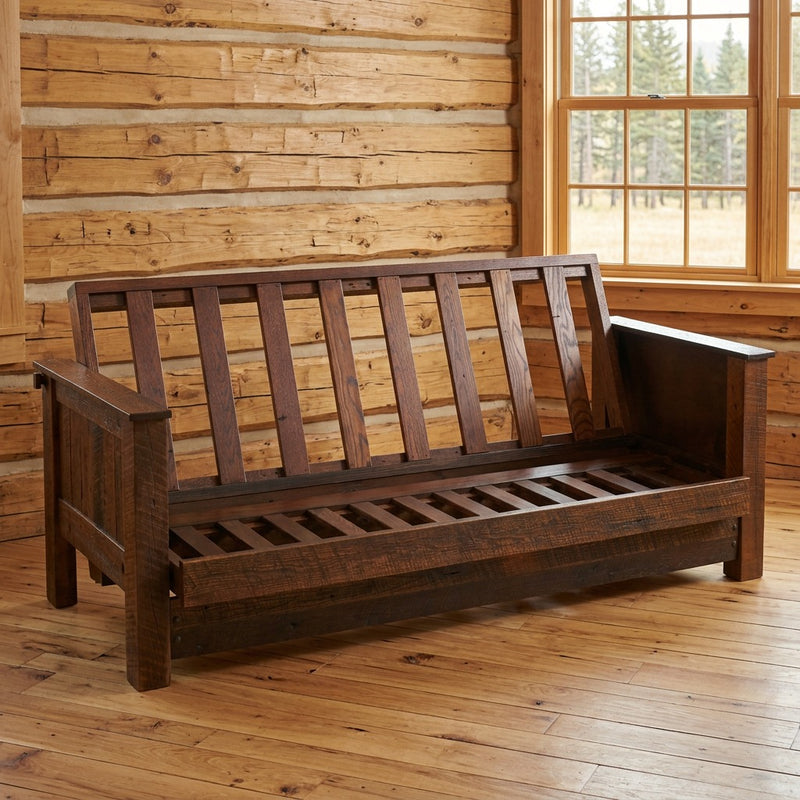 Tweto Mountain Reclaimed Barnwood Futon staged in a sunlit log cabin living room